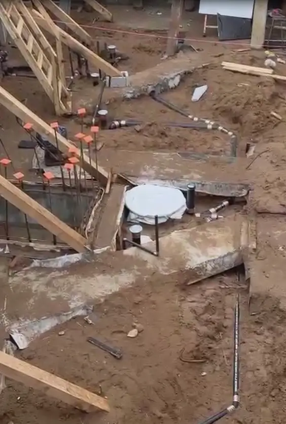 Underground plumbing rough-in with drain pipes