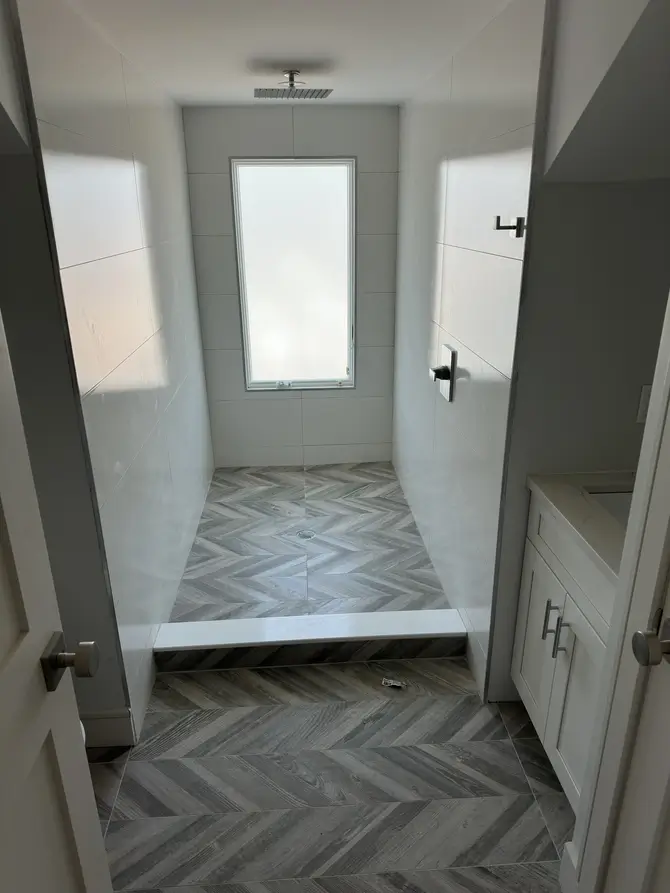 Modern laundry room with stacked washer and dryer