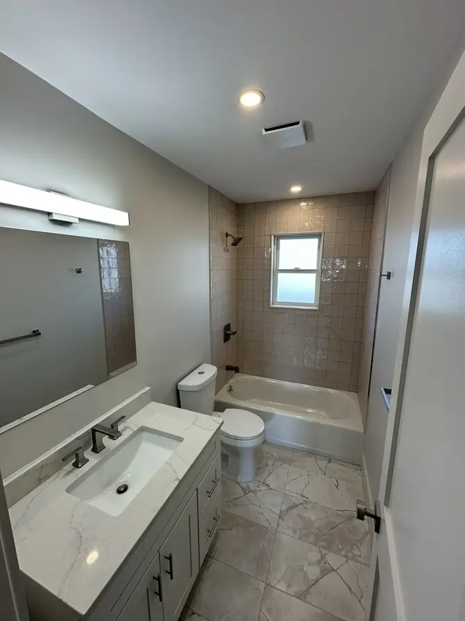 Contemporary bathroom with vanity and mirror
