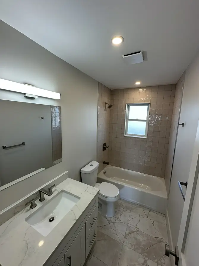 Modern bathroom with bathtub and vanity