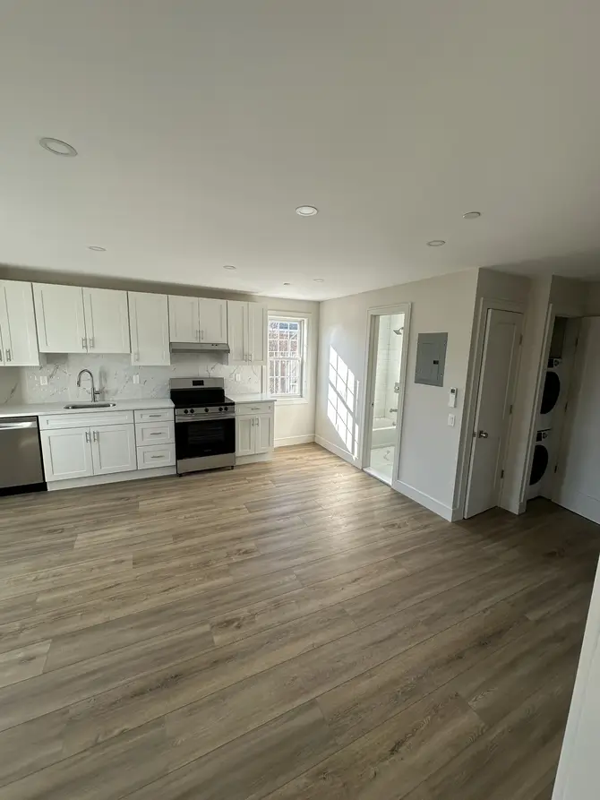Open-concept kitchen and living room with natural light