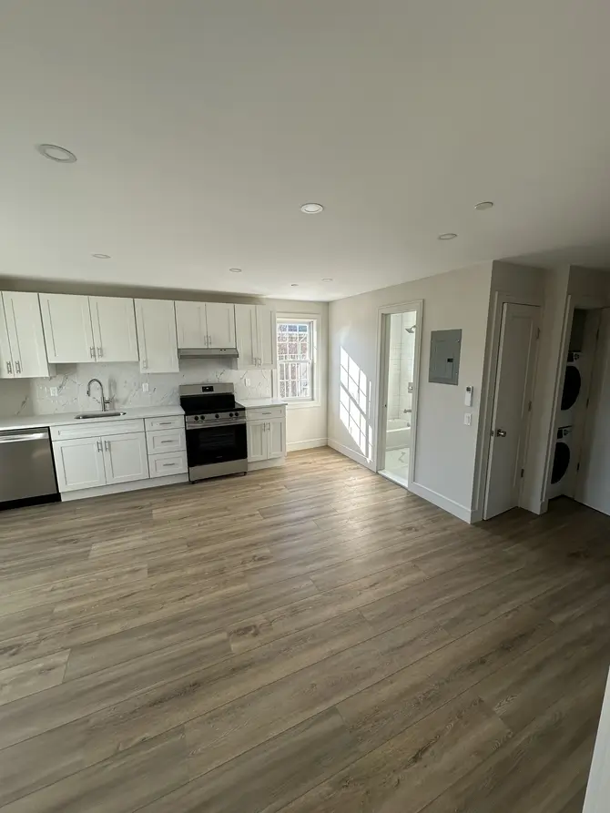 Modern kitchen and living area after renovation