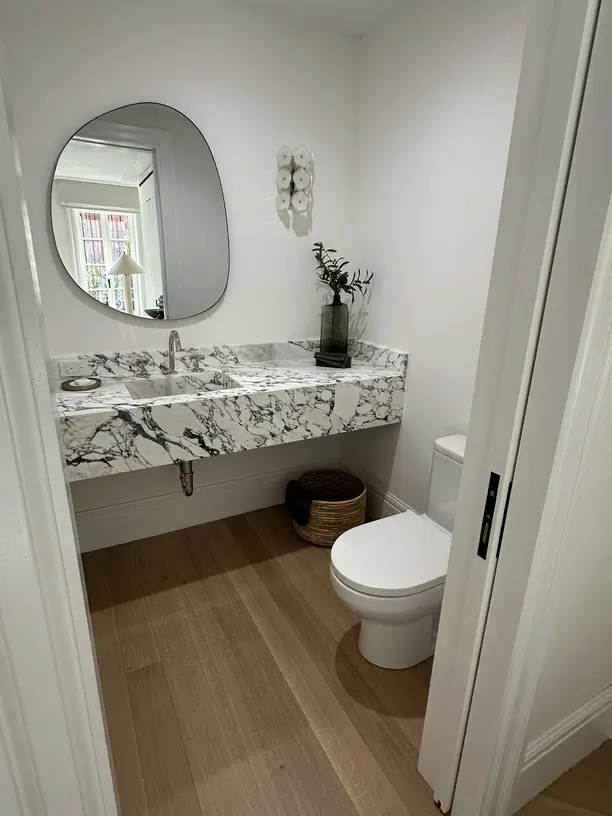 Bathroom vanity with round mirror