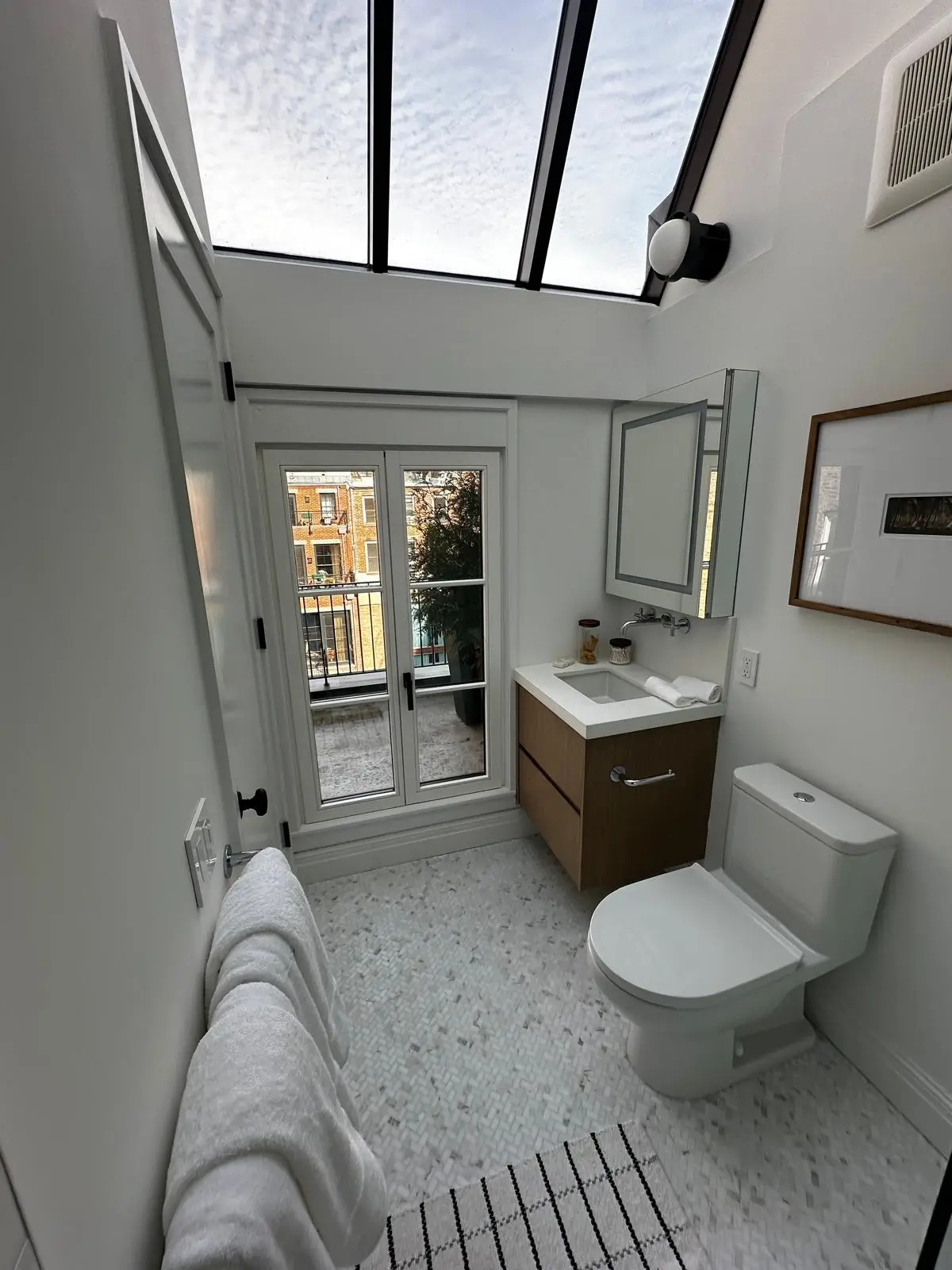 Bathroom with skylight and vanity