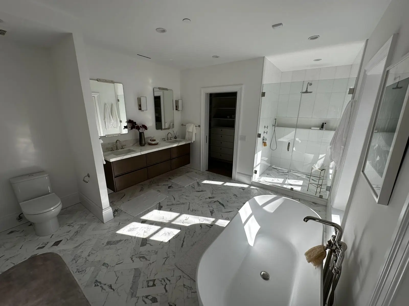 Walk-in shower with white tile
